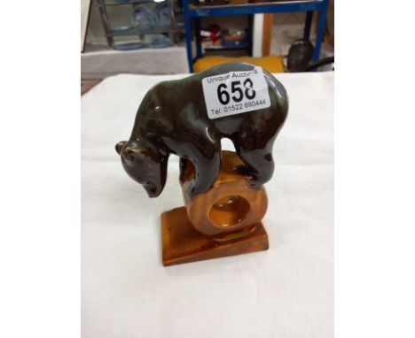 A Vintage brown bear on a log made in the USSR.  Lonokovo "The Wheel" faience bear figurine stamped USSR and the Lonakovo fac