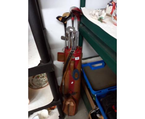 A vintage golf bag and clubs, 