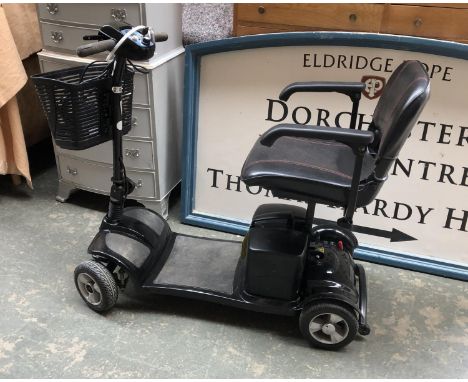 A Kymco K Lite mobility scooter, with charger, in need of new batteries 