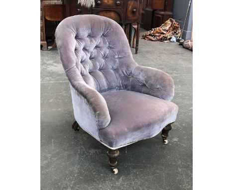 A 19th century buttonback armchair on turned legs and ceramic C&amp;C casters, 71cmW 