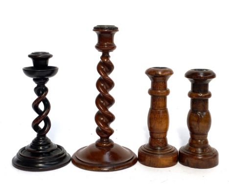 A 19th century double helix candlestick, with well turned drip pan, 20cmH; a barleytwist candlestick, 25cmH; and a further pa