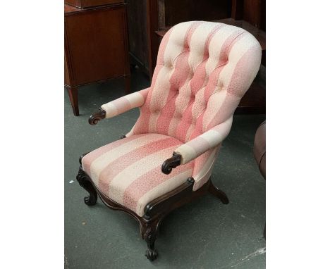A Victorian button back salon chair with carved frame 