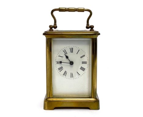 A 19th century brass carriage clock, the white dial with Roman Numerals, 14cmH 