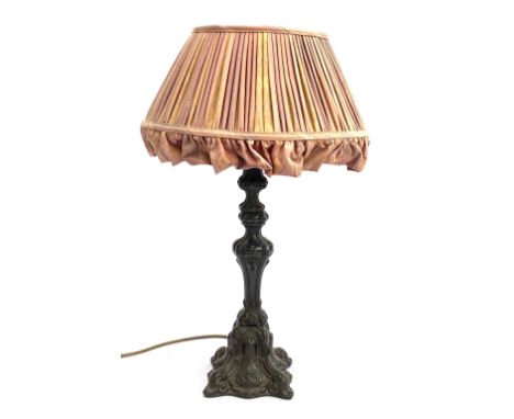 A cast metal table lamp, with pleated shade, 40cmH to base of fitting 