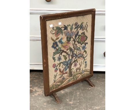 A glazed needlework firescreen, 61cmH 