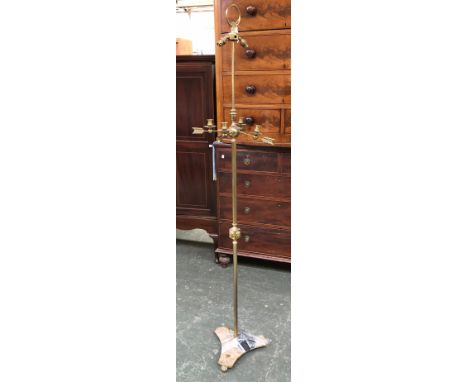 A brass two fitting standard lamp, with four candle sconces on arrow shaped supports, 184cmH 