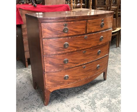 A Regency mahogany bowfront chest of two short over three graduating drawers on swept bracket feet, 106x51x103cmH 