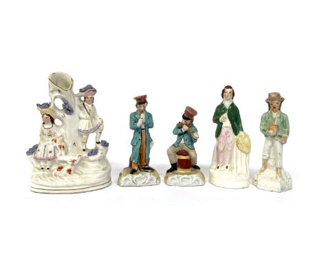 Five small ceramic figurines, to include a Staffordshire spill vase, 12.5cmH 