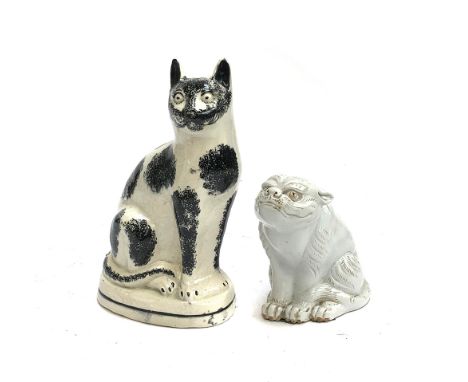 An Staffordshire cat, 27cmH; together with a Hirado ware model of a tiger, 15cmH