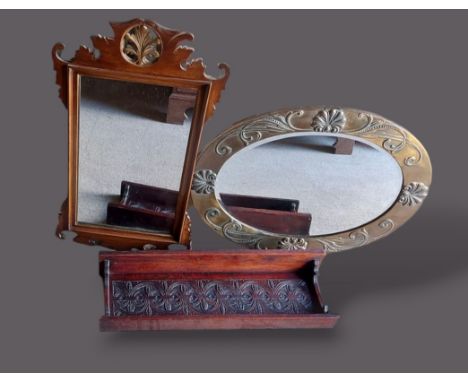 A 19th Century Chippendale style wall mirror together with an oval wall mirror and a small oak bracket 