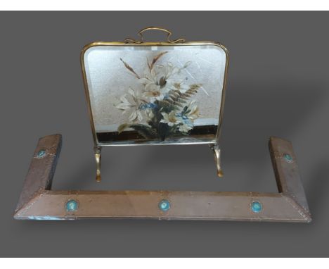 An Arts and Crafts copper fire curb with Ruskin type circular panels together with a brass and mirrored firescreen, a brass t