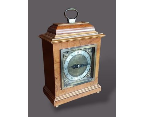 A 20th Century walnut cased mantel clock with brass dial inscribed Elliott London, 20cms tall