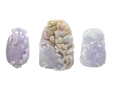 A GROUP OF THREE CHINESE LAVENDER JADE PENDANTS intricately carved pendants of lavender tone, some with pale green inclusions