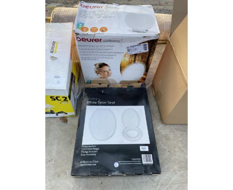 A BOXED TOILET SEAT AND A BEURER WELLBEING THERAPY LAMP 