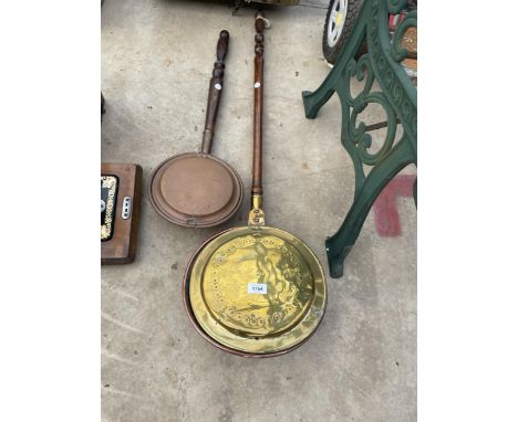 A VINTAGE BRASS BED WARMING PAN AND A VINTAGE COPPER BED PAN 