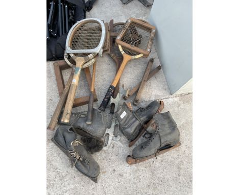 AN ASSORTMENT OF VINTAGE SPORTS EQUIPMENT TO INCLUDE TENNIS RACKETS AND ICE SKATES ETC 