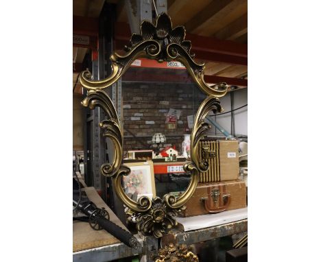 A VINTAGE GILT FRAMED SHIELD SHAPED MIRROR, 50CM X 71CM 