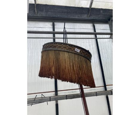 A VINTAGE LIGHT FITTING WITH STRING SHADE 