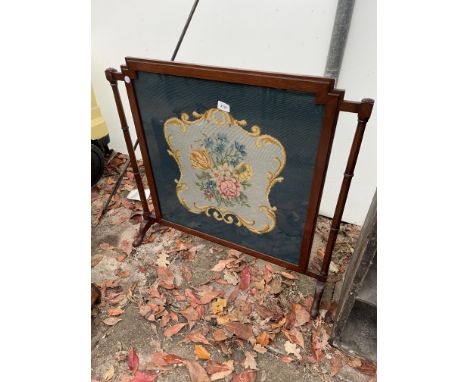 A VICTORIAN MAHOGANY FIRESCREEN WITH WOOLWORK PANEL 