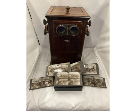 A VINTAGE REVOLVING STEREOSCOPE VIEWER WITH A BOXED SET OF CARD 