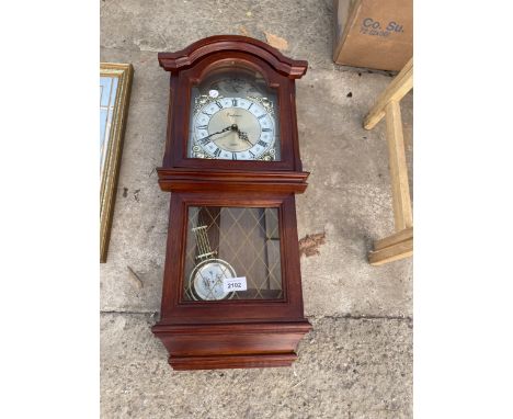 A WOODEN CASED EMPEROR QUARTZ WALL CLOCK 