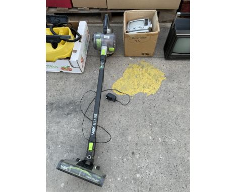 A VAX STICK VACUUM CLEANER WITH CHARGER AND A PORTABLE TELEVISION 