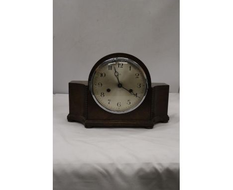 A VINTAGE GERMAN MANTLE CLOCK IN WORKING ORDER AT CATALOGUING, NO WARRANTY GIVEN 