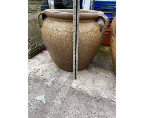 A LARGE DECORATIVE SALT GLAZED PLANTER WITH THREE HANDLES 