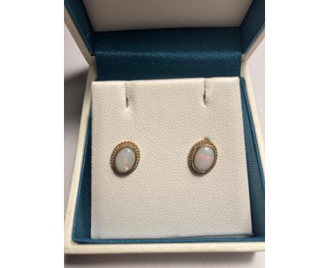 A PAIR OF 9 CARAT GOLD AND OPAL EARRINGS IN A PRESENTATION BOX 