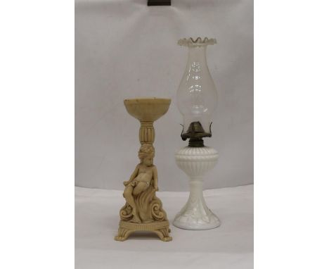 A WHITE BASED GLASS FLUTED SHADE OIL LAMP AND A CHERUB DESIGN FLOWER ARRANGIMG STAND 