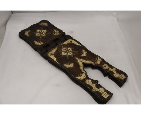 A VINTAGE CARVED CROSSOVER BOOK STAND 