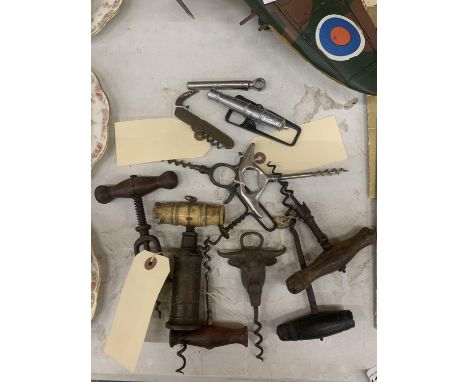 A COLLECTION OF VINTAGE PIGTAIL CORKSCREWS, SOME WITH WOODEN HANDLES AND BOTTLE OPENERS - 12 IN TOTAL 