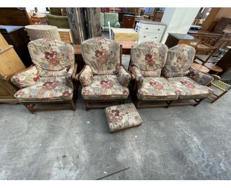 AN ERCOL OLD COLONIAL YORK MINSTER LOUNGE SUITE, COMPRISING SETTEE, TWO CHAIRS, AND ADJUSTABLE FOOT STOOL 