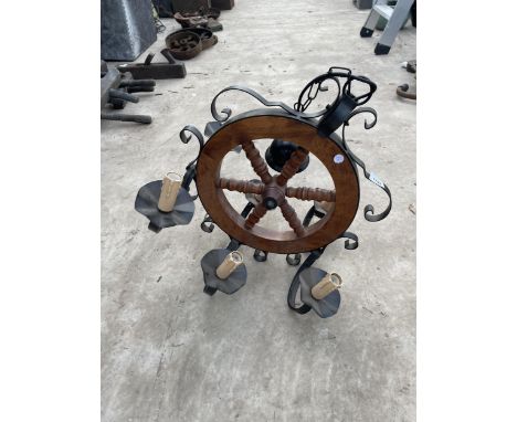 A VINTAGE CEILING MOUNTED LIGHT FITTING WITH SHIPS WHEEL DESIGN 