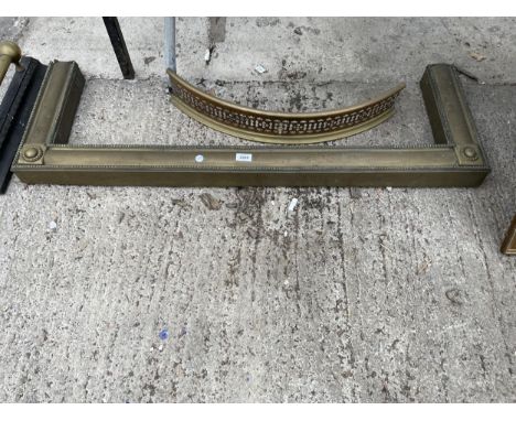 A VINTAGE DECORATIVE BRASS FIRE FENDER AND A FURTHER FIRE FRONT 