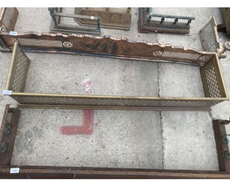 A VINTAGE BRASS FIRE FENDER WITH PIERCED PANELS 