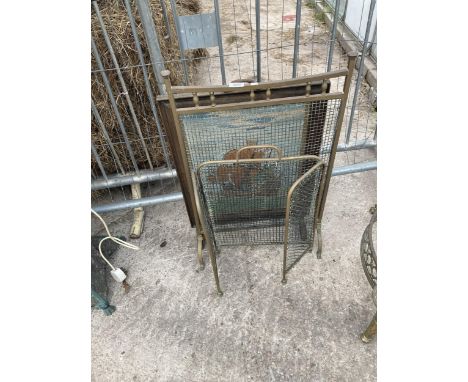 TWO BRASS FIRE SCREENS AND A FURTHER OAK FRAMED FIRE SCREEN WITH SHIP DETAIL 
