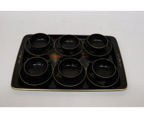 AN ORIENTAL HANDPAINTED, LACQUERED TRAY WITH SIX CUPS AND SAUCERS 