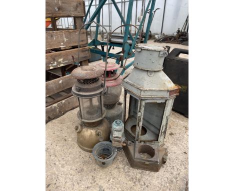 TWO VINTAGE PARAFIN LANTERNS AND FURTHER LANTERN SPARES 