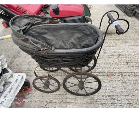 A VINTAGE MINIATURE DOLLS PRAM 