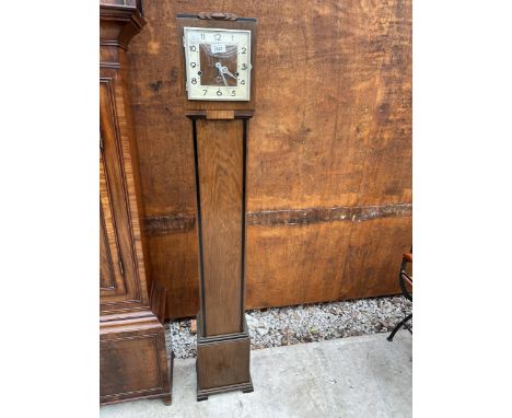 A WALNUT ART DECO GRANDMOTHER CLOCK WITH EBONISED DECORATION 
