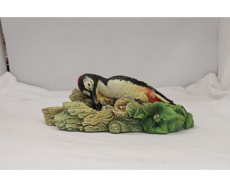 A BOSSUN'S WALL HANGING MODEL OF A WOODPECKER 