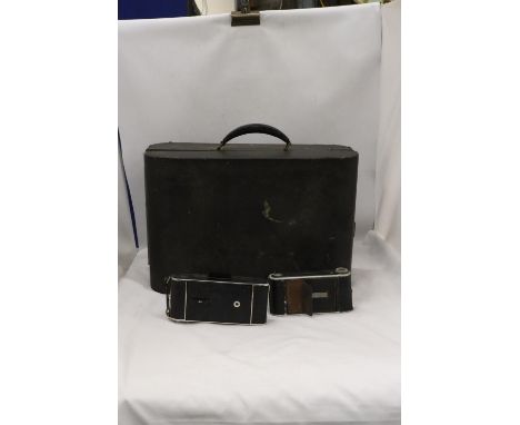 A VINTAGE DECCA SALON GRAMOPHONE PLAYER PLUS TWO VINTAGE CAMERAS IN CASES 