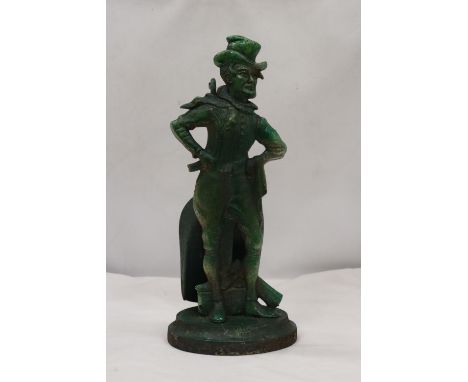 A VINTAGE CAST DOORSTOP WITH A SHOVEL 