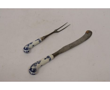 A LATE 18TH CENTURY DELFT PISTOL HANDLED KNIFE AND FORK 