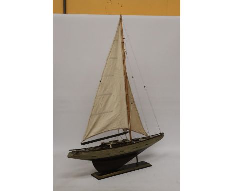 A LARGE WOODEN MODEL OF A SAILING BOAT ON A WOODEN STAND, HEIGHT 104CM, WIDTH 75CM 