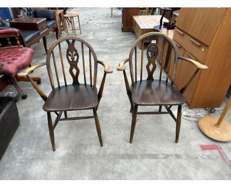 A PAIR OF ERCOL BLUE LABEL PLUME OF FEATHERS CARVER CHAIRS 
