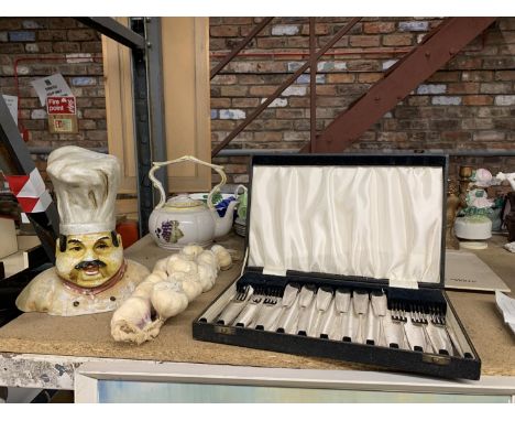 A VINTAGE KNIFE AND FORK SET, IN ORIGINAL CASE, A CHEF'S HEAD BUST, ETC 
