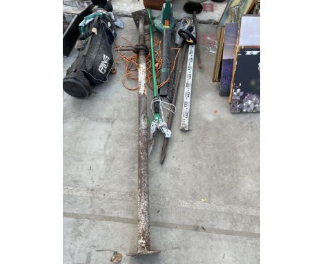 AN ASSORTMENT OF TOOLS TO INCLUDE AN ACRO PROP, TITAN ELECTRIC HEDGE TRIMMER AND A CROW BAR ETC 