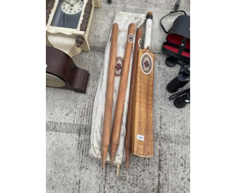 A VINTAGE WOODEN 'FOSTER BREWING CO.' CRICKET BAT AND STUMPS 